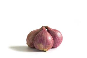 Three red onions isolated on a white background photo