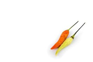 close-up of red and green chilies with white blank space background photo