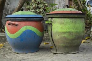 Two colorful trash cans from used car rubber tires. photo