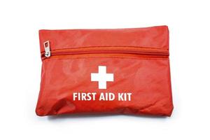 Portable red first aid kit bag with a zip usually placed in the car, in closeup photo