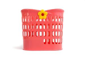 Red plastic basket used to put cleaned spoons, forks and knives photo