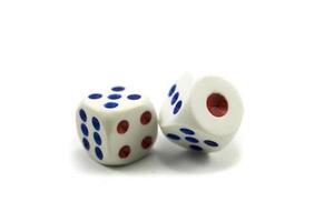 Three plastic dice isolated on a white background, a dice is a small object photo