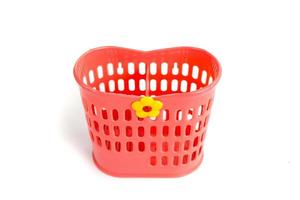 Red plastic basket used to put cleaned spoons, forks and knives photo