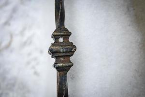 The metal fence dtail on white fluffy snowdrift in winter photo