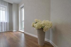 vase with a bouquet of flowers in the interior photo