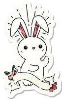 worn old sticker of a tattoo style cute bunny vector