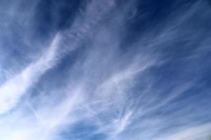 Stunning cirrus cloud formation panorama in a deep blue sky photo