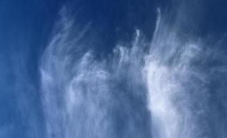 Stunning cirrus cloud formation panorama in a deep blue sky photo