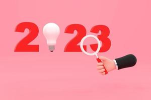 light bulb and magnifying glass. finding or searching ideas concept on new year. photo