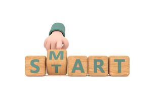 Hand turns dice and changes the word smart to start. photo