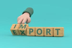 Hand turns dice and changes the word import to export. photo
