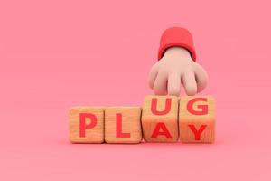 Hand turns dice and changes the word plug to play. photo