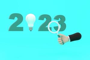 light bulb and magnifying glass. finding or searching ideas concept on new year. photo