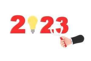 light bulb and magnifying glass. finding or searching ideas concept on new year. photo