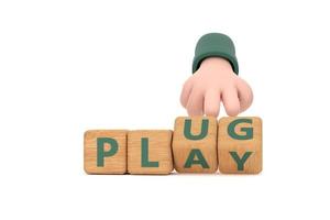 Hand turns dice and changes the word plug to play. photo