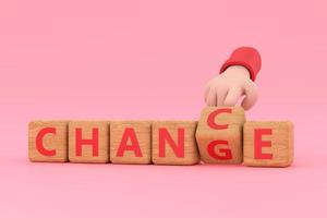 Hand turns dice and changes the word chance to change. photo