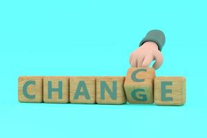 Hand turns dice and changes the word chance to change. photo