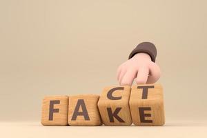 Hand turns dice and changes the word fake to fact. photo