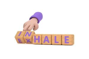 Hand turns dice and changes the word INHALE to EXHALE. Inhale,Exhale concept. photo