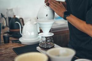 Drip coffee,Close up of hand brewing coffee photo