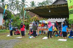 Blitar, Indonesia - September 11th 2022 A group of Indonesian youths are preparing to compete in a traditional Indonesian game called Balap Karung or Sack Race on Indonesian Independence Day photo