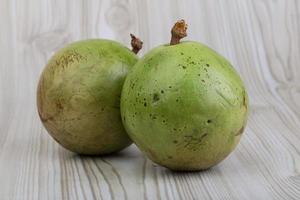 Sapote on wooden background photo