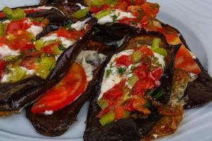 Grilled eggplant on the plate photo