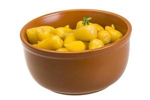 Marinated pepper in a bowl on white background photo