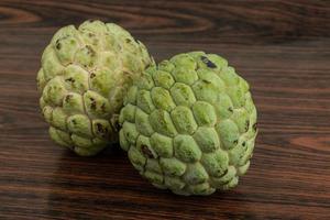 Custard apple on wooden background photo