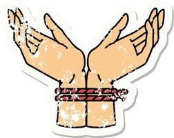 distressed sticker tattoo in traditional style of a pair of tied hands vector