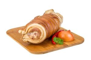 Bacon on wooden board and white background photo