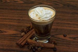 Coffee capuccino on wooden background photo