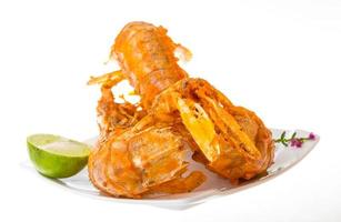 Grilled crawdads on white background photo