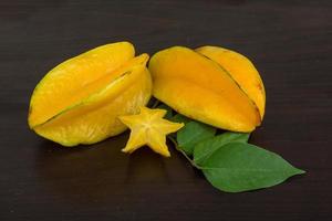 Carambola on wooden background photo