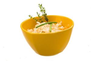 Fermented Cabbage in a bowl on white background photo