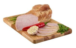 Ham on the board on wooden board and white background photo