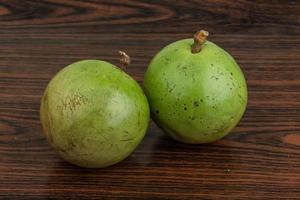 Sapote on wooden background photo