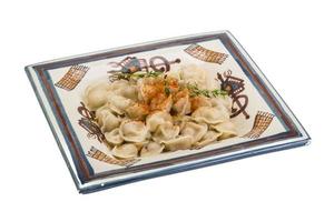 Dumplings on the plate and white background photo