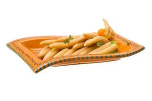 Baby corn on the plate and white background photo