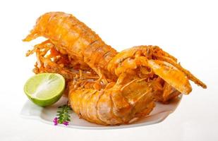 Grilled crawdads on white background photo