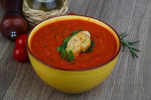 Gazpacho in a bowl on wooden background photo