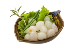 Small marinated onion in a bowl on white background photo