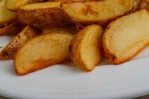 Fried potato on the plate photo