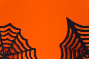 Halloween concept. Festive decorations on orange background. Minimalistic design. photo