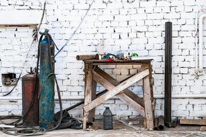 Old gas cylinders for welding and cutting. Rusty propane and oxygen tanks. photo