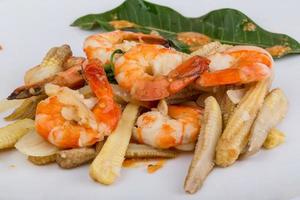 Shrimp and corn salad on the plate photo
