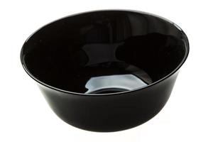 Empty black bowl on white background photo