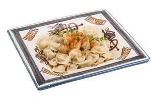 Dumplings on the plate and white background photo