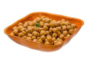 Chickpea in a bowl on white background photo