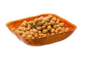 Chickpea in a bowl on white background photo